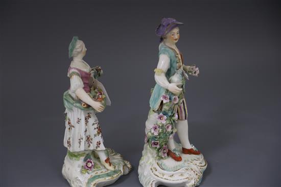 A pair of large Derby figures of flower sellers, c.1760, H. 26.5 and 24.5cm